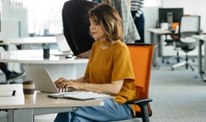 A business Card Member paying her bills