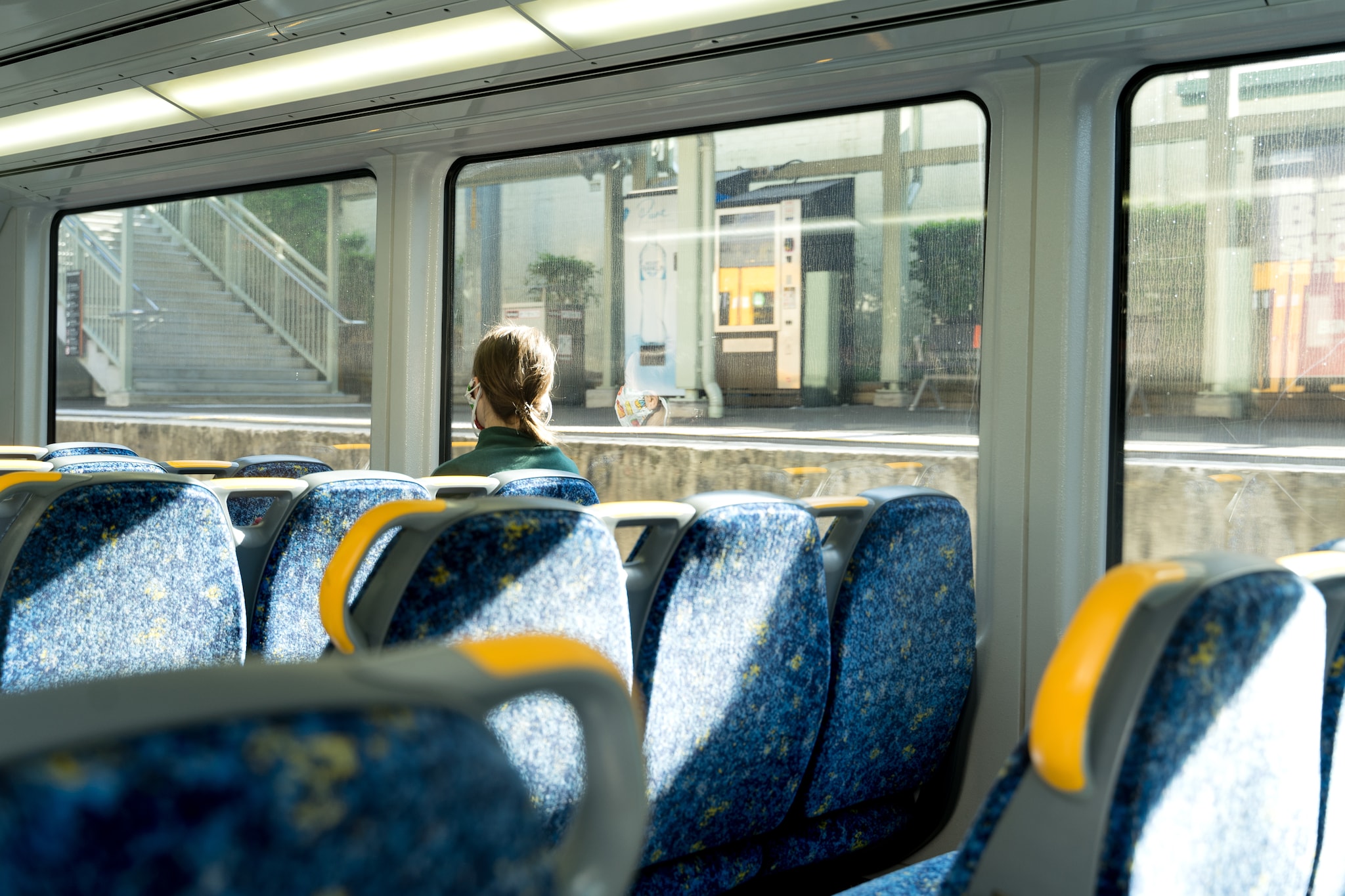 A lady listening to music while travelling. A lady listening to music while travelling.
