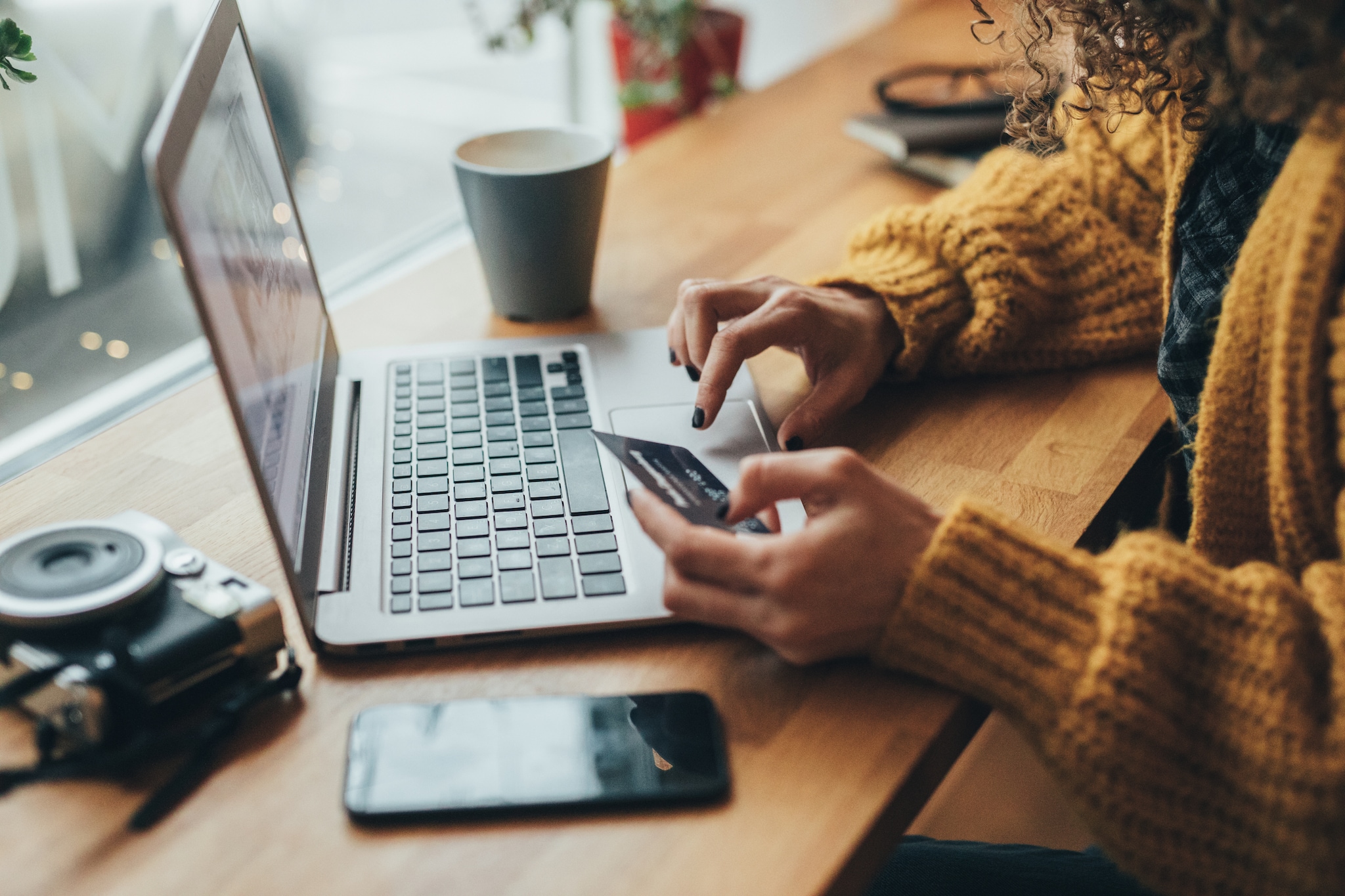 A lady entering her Amex Card details on a laptop. A lady entering her Amex Card details on a laptop.
