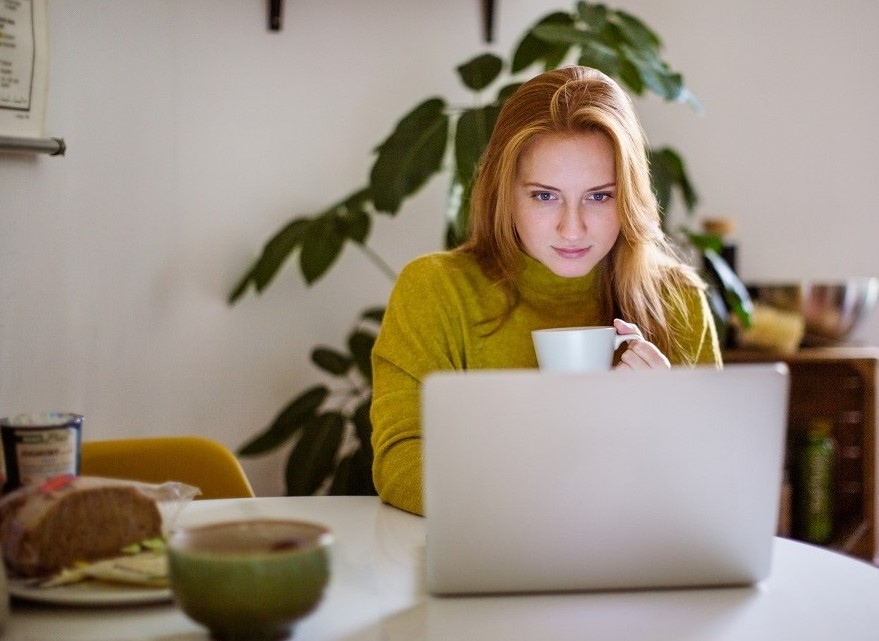 A lady looking at her laptop screen. A lady looking at her laptop screen.