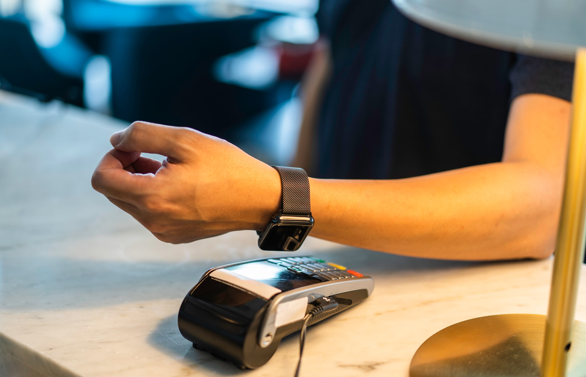 A man making payment using his wearable. A man making payment using his wearable.