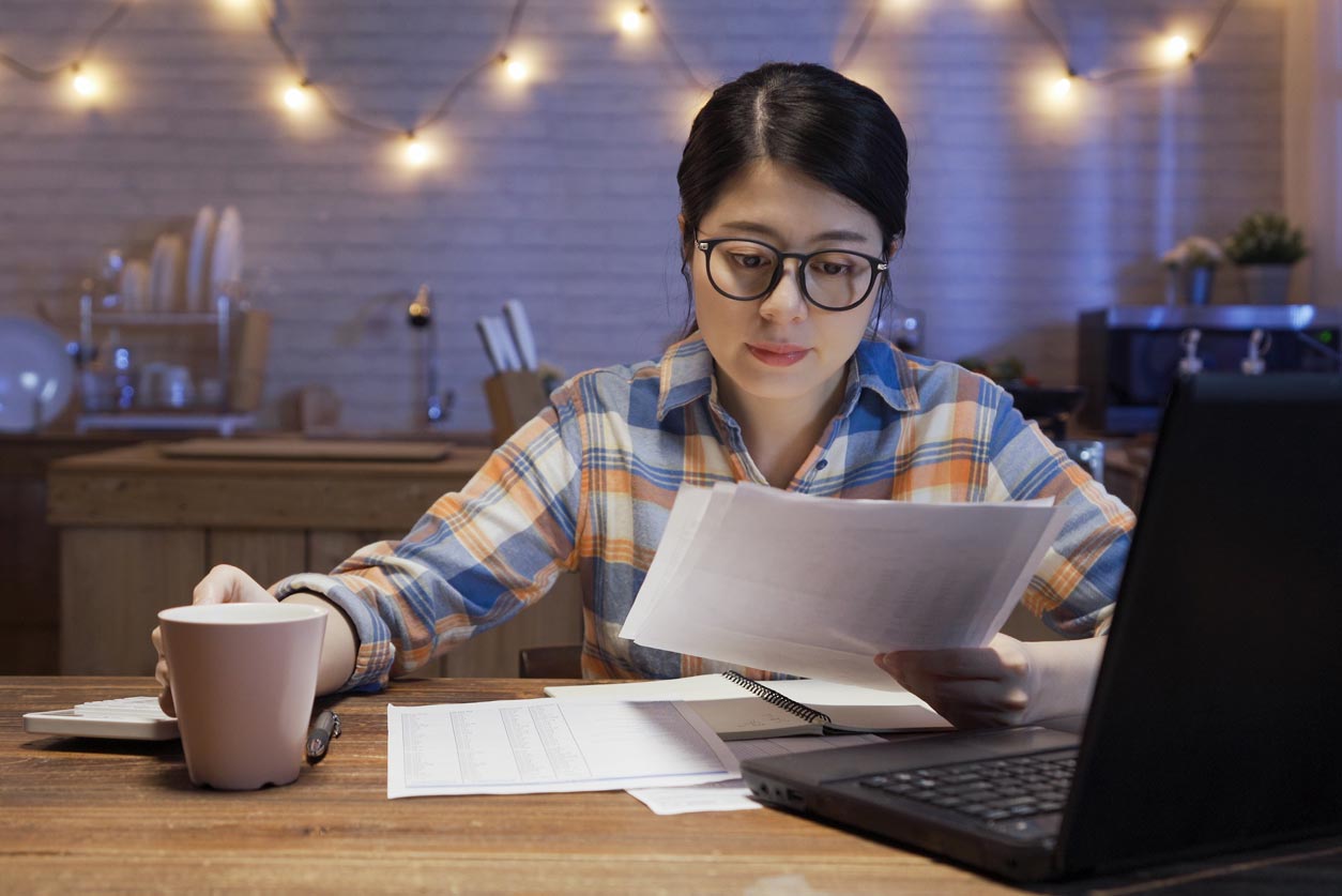 Girl is reading the paper in her hand