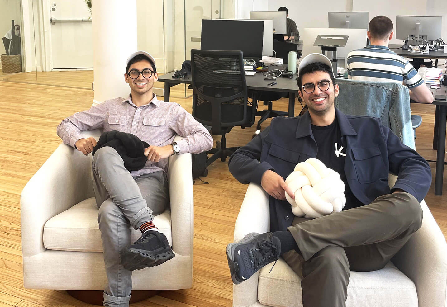 American Express and Knot Announce New Functionality 2 People on couch holding pillow